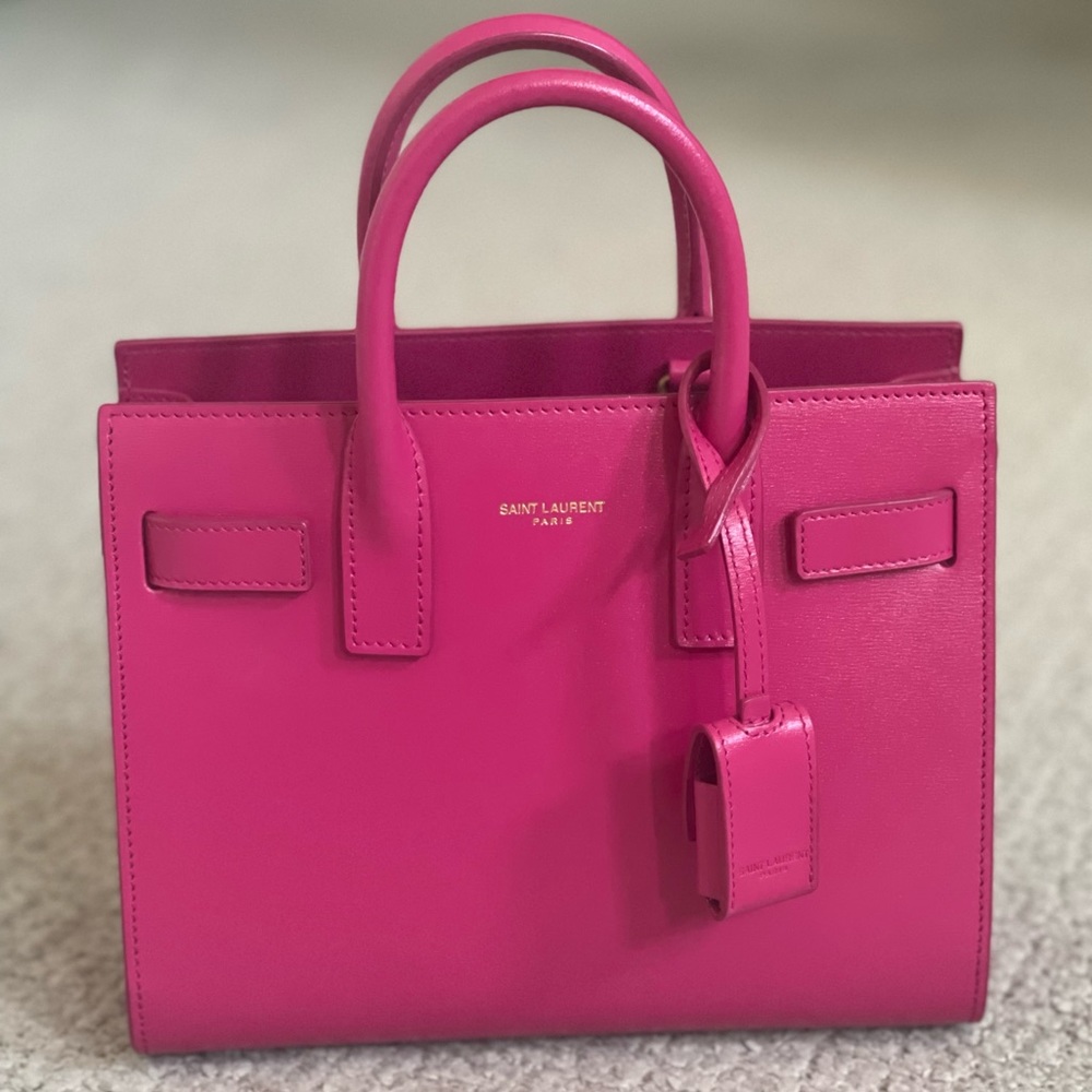 SAC DE JOUR NANO IN LIPSTICK PINK. COMES WITH STRAP, CARDS, AND DUSTBAG